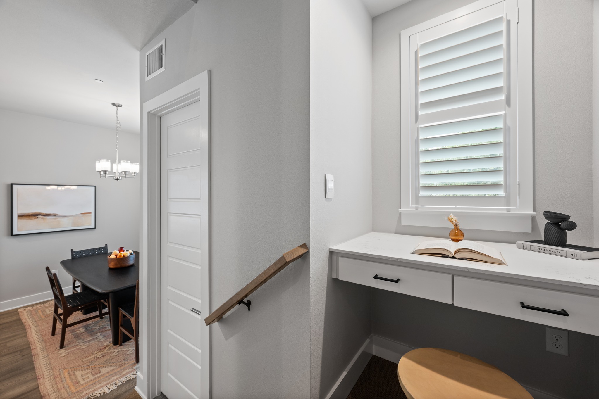 4515 Unity Circle Austin, TX 78731 - Photo 14 of 37 An integrated study nook offers a quiet workspace alongside the main dining area.