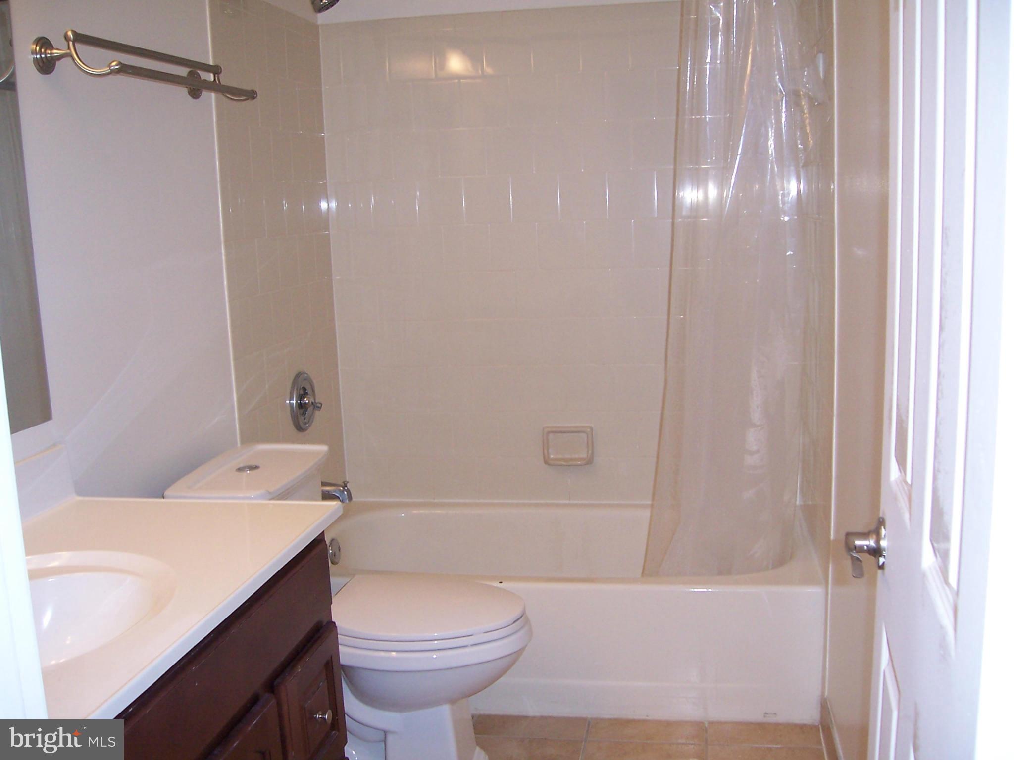 14621 Colonels Choice Road Upper Marlboro, MD 20772 - Photo 12 of 25 a bathroom with a sink a toilet and shower