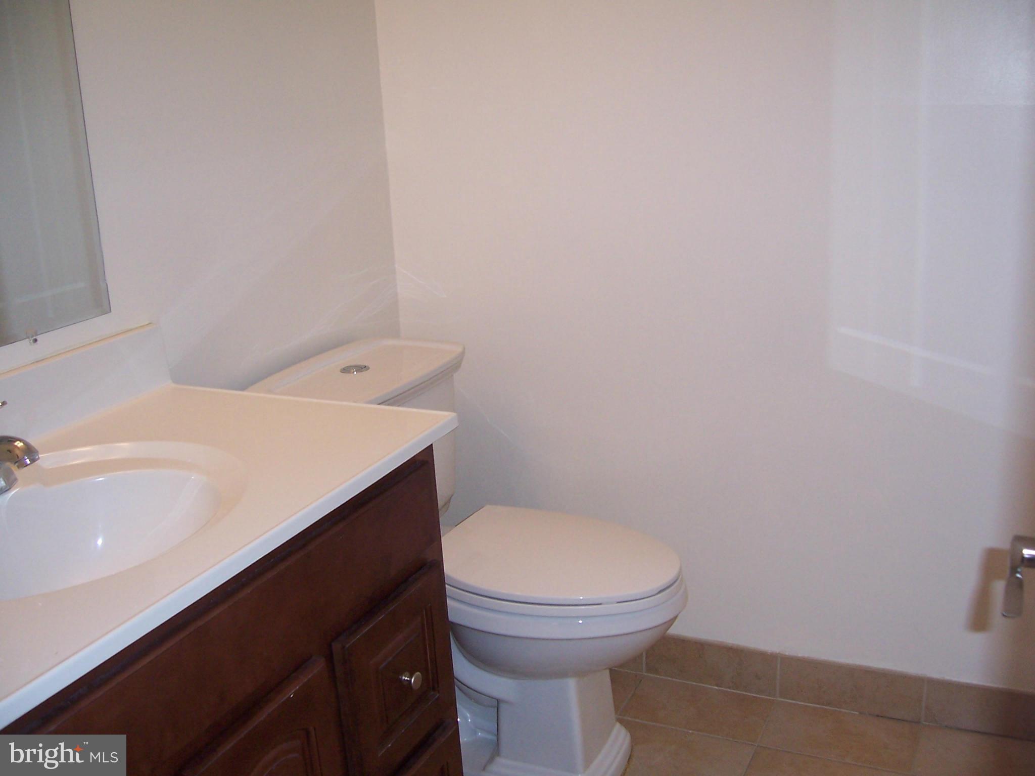 14621 Colonels Choice Road Upper Marlboro, MD 20772 - Photo 13 of 25 a bathroom with a sink and a toilet