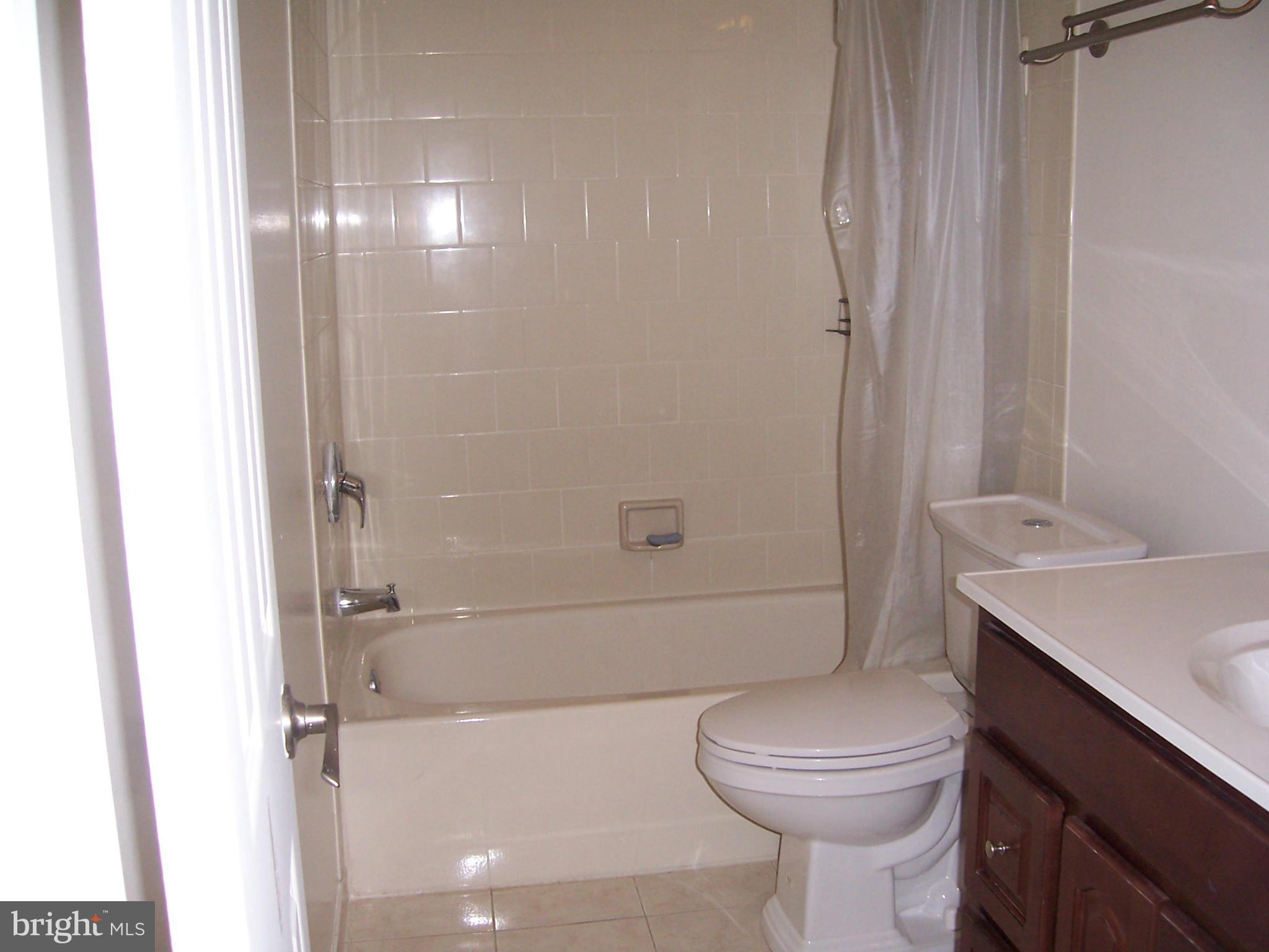 14621 Colonels Choice Road Upper Marlboro, MD 20772 - Photo 8 of 25 a bathroom with a sink toilet and shower