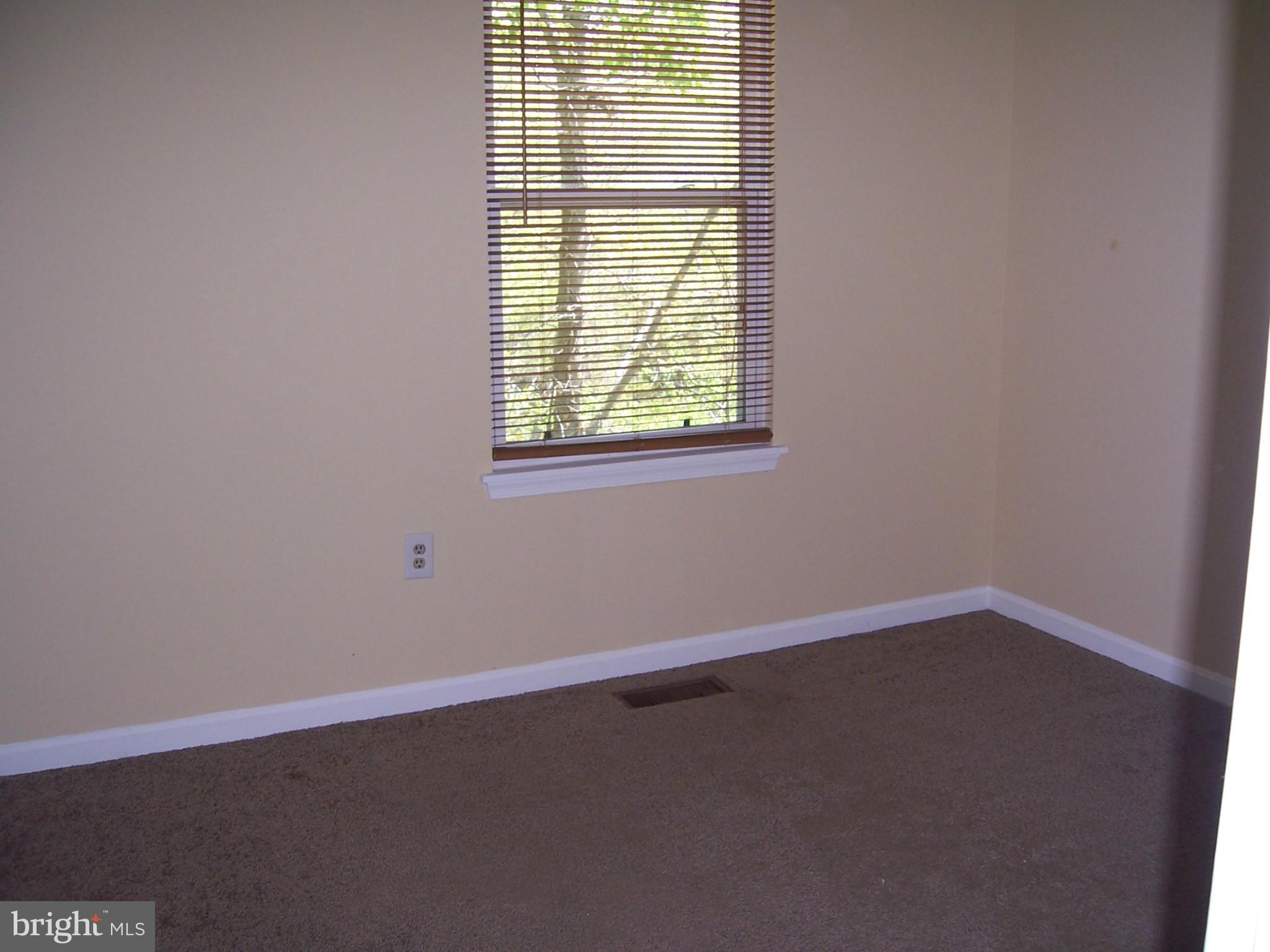 14621 Colonels Choice Road Upper Marlboro, MD 20772 - Photo 10 of 25 an empty room with a window