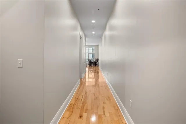 a view of a workspace with furniture and wooden floor