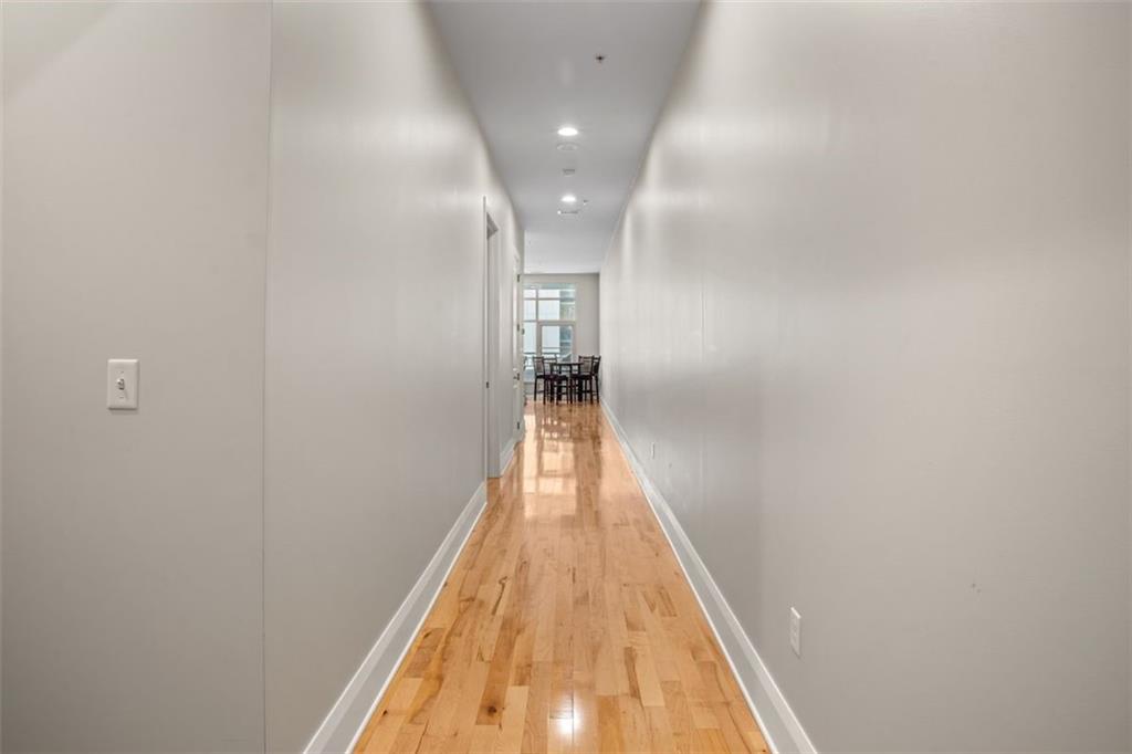 301 Fifth Avenue, Unit 606 Pittsburgh, PA 15222 - Photo 15 of 27 a view of a hallway with wooden floor
