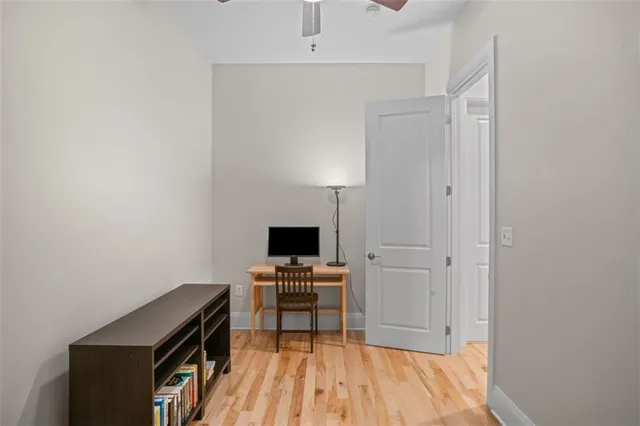 a room with a bed and a book shelf