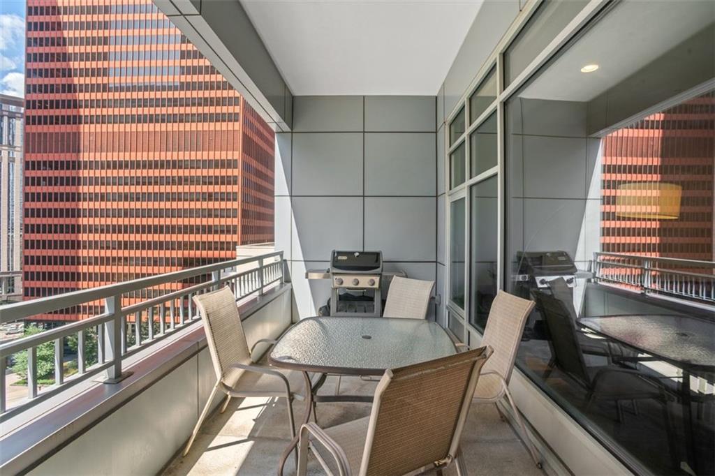 301 Fifth Avenue, Unit 606 Pittsburgh, PA 15222 - Photo 21 of 27 a dining room with furniture and wooden floor