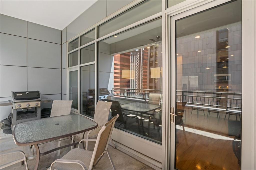 301 Fifth Avenue, Unit 606 Pittsburgh, PA 15222 - Photo 23 of 27 a kitchen with a table and chairs