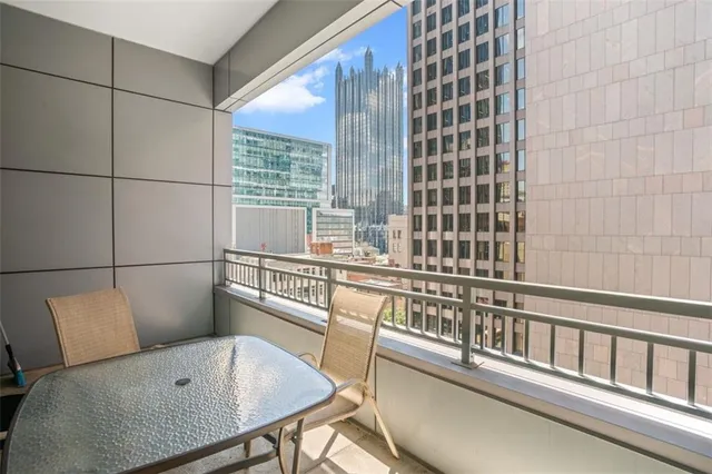 a view of a patio with table and chairs and potted plants