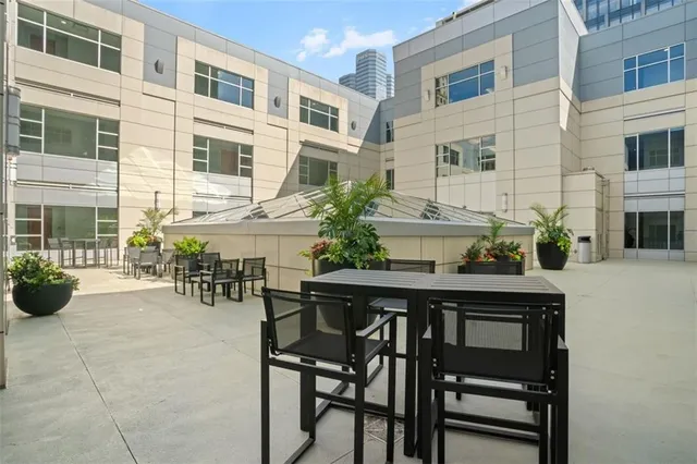 a view of a chairs and table in the patio