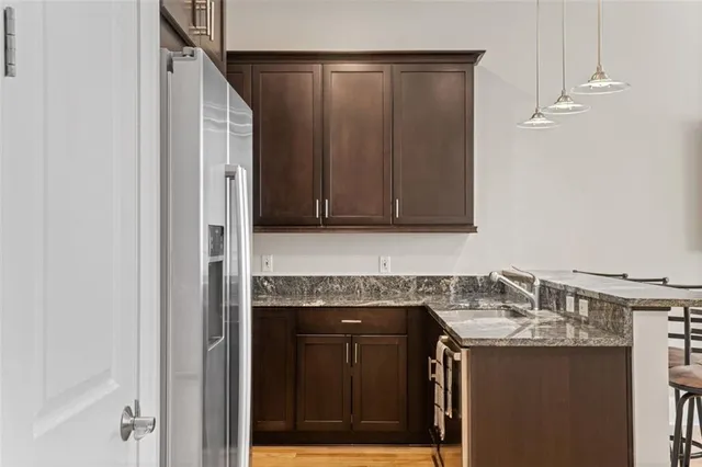 a stove top oven sitting inside of a kitchen