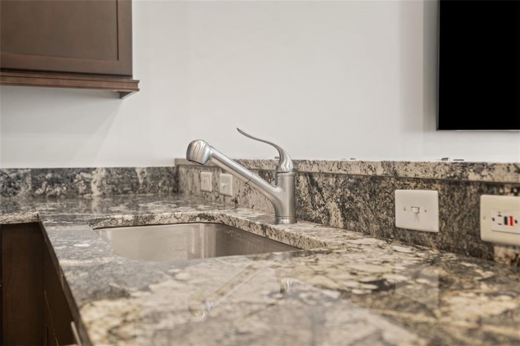 301 Fifth Avenue, Unit 606 Pittsburgh, PA 15222 - Photo 9 of 27 a kitchen with a sink and cabinets