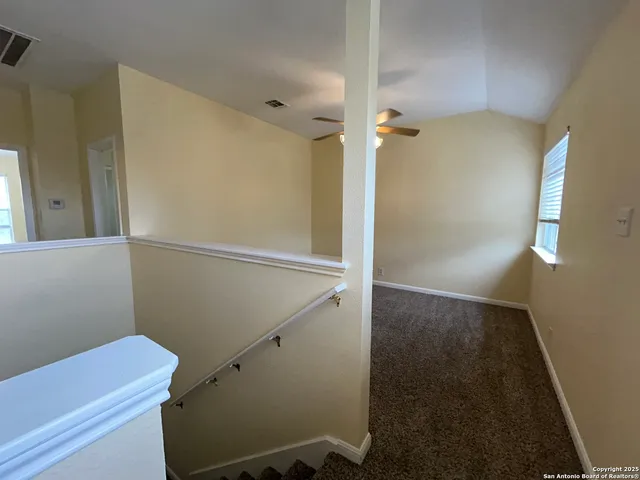 a bathroom with a shower and a toilet