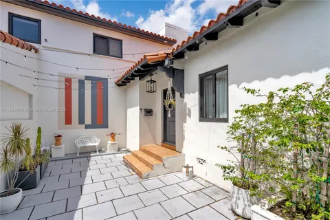 a view of a entryway with flower pots
