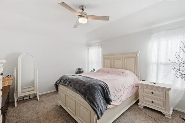 a bedroom with a bed and a dresser