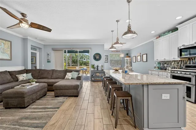 a large kitchen with granite countertop lots of counter space and window