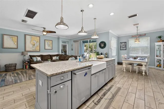 a bathroom with a sink vanity granite and toilet