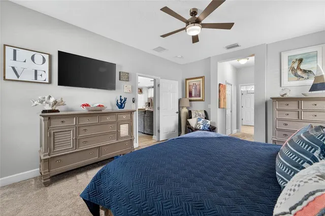 a living room with furniture and painting on the wall