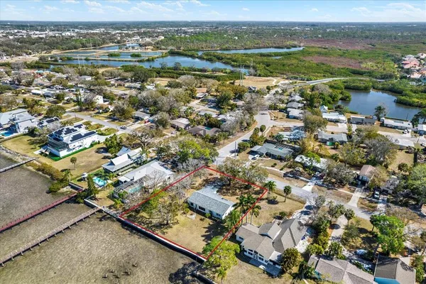 an aerial view of residential houses with outdoor space