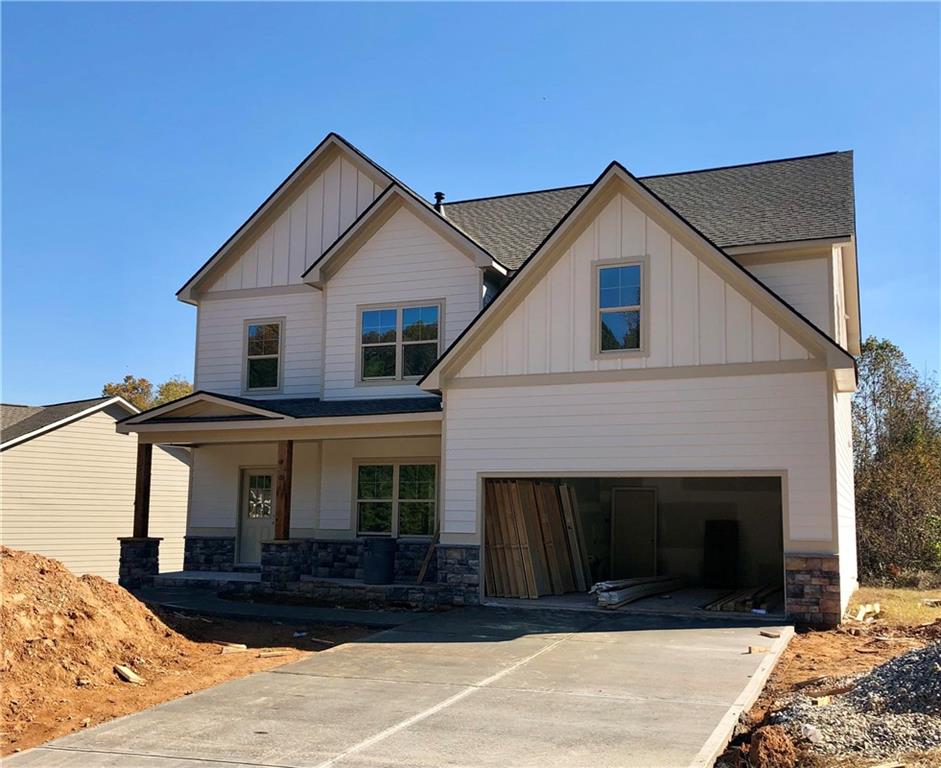 112 Cyn Rdg Trail Canton, GA 30114 - Photo 1 of 1 a front view of a house with a yard