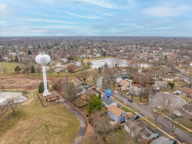 aerial view of a house with a yard