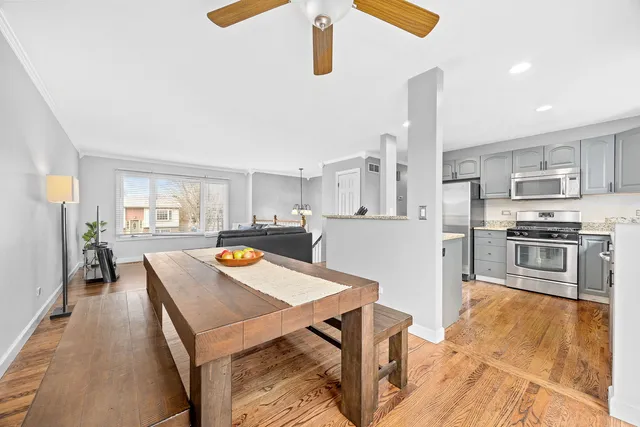 a kitchen with stainless steel appliances granite countertop a sink a stove top oven a counter space and cabinets