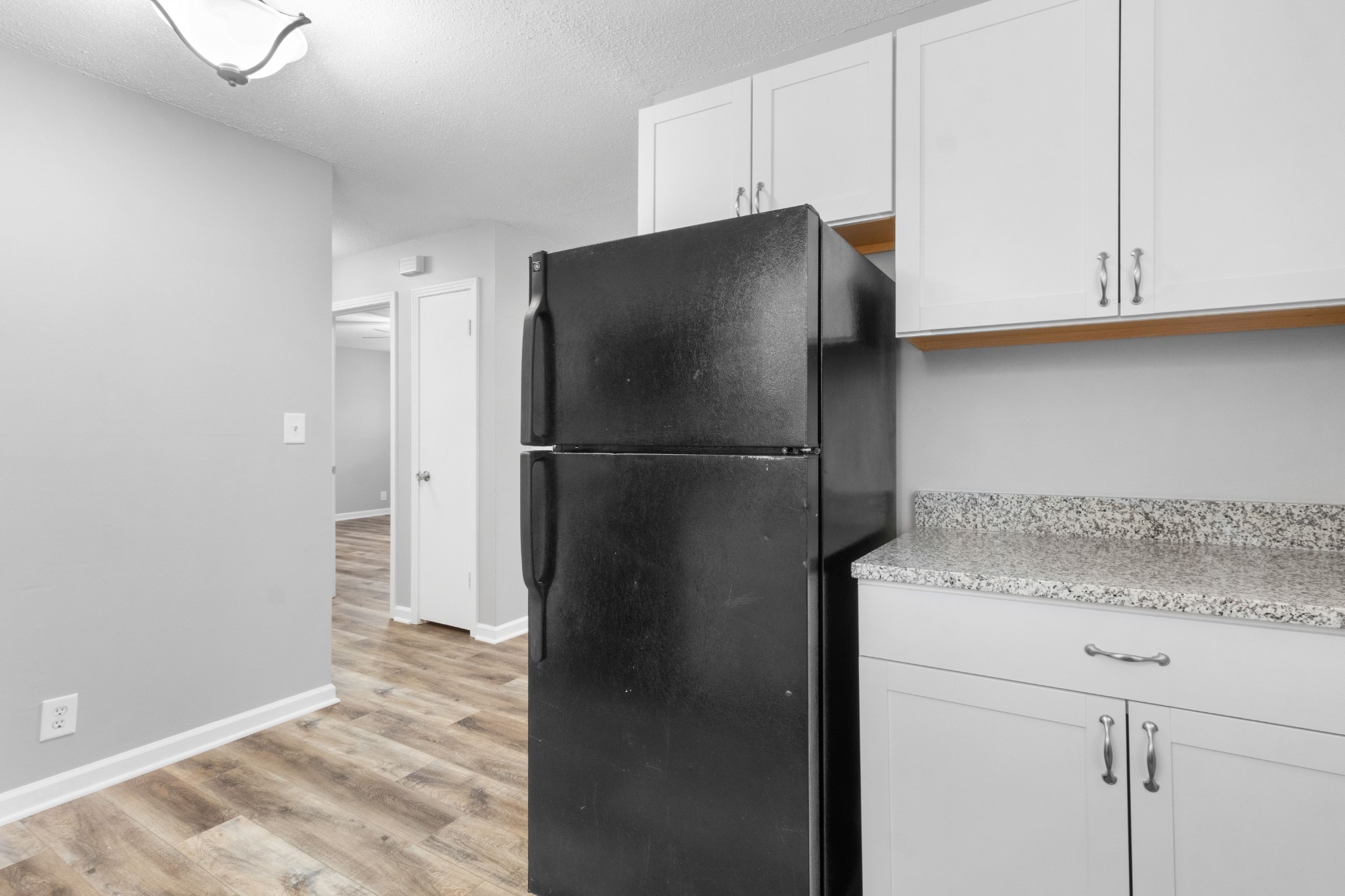 2251 7 Mile Ferry Road, Unit 9 Clarksville, TN 37040 - Photo 11 of 26 a kitchen with a refrigerator and cabinets