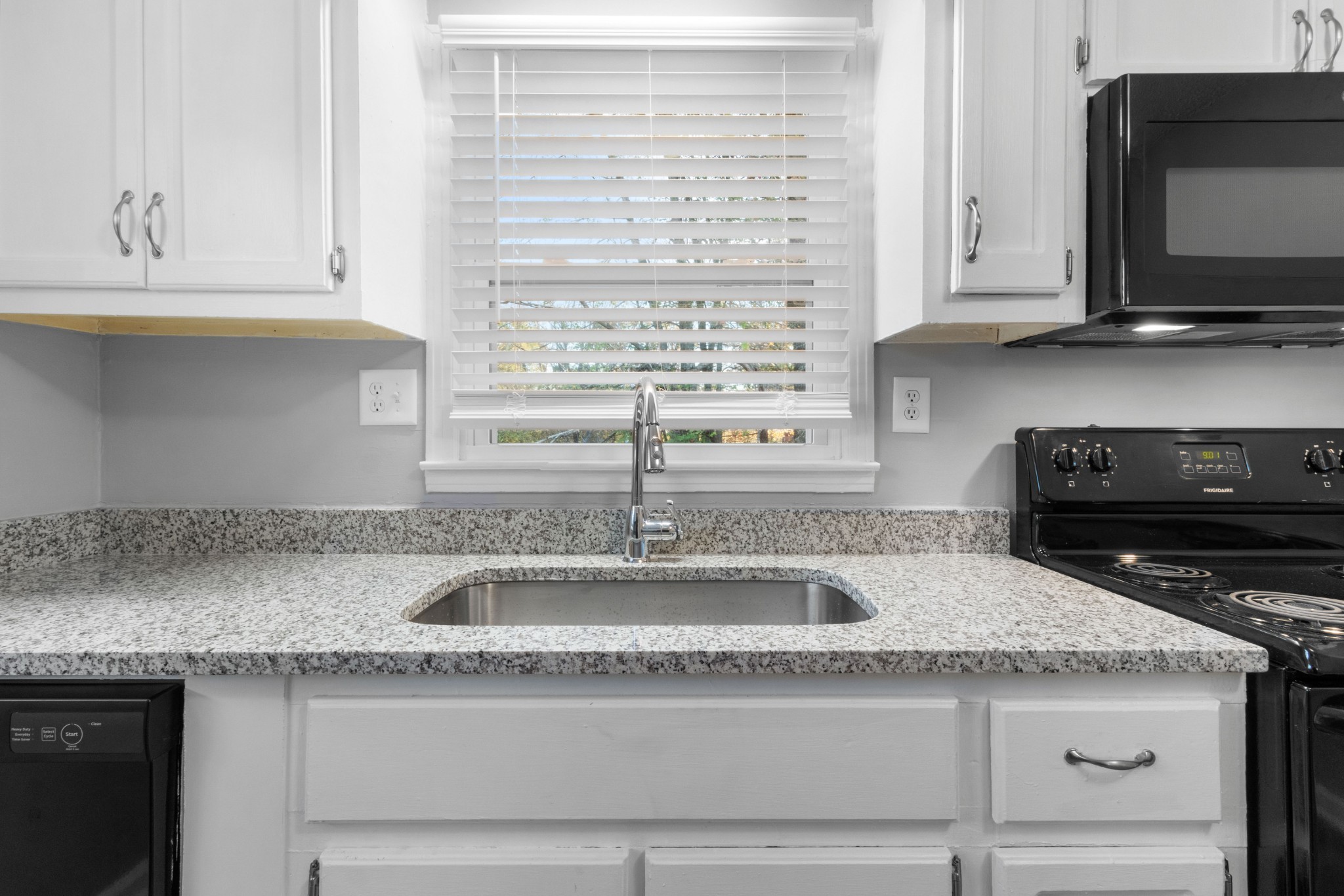2251 7 Mile Ferry Road, Unit 9 Clarksville, TN 37040 - Photo 12 of 26 a kitchen with granite countertop a sink and a stove