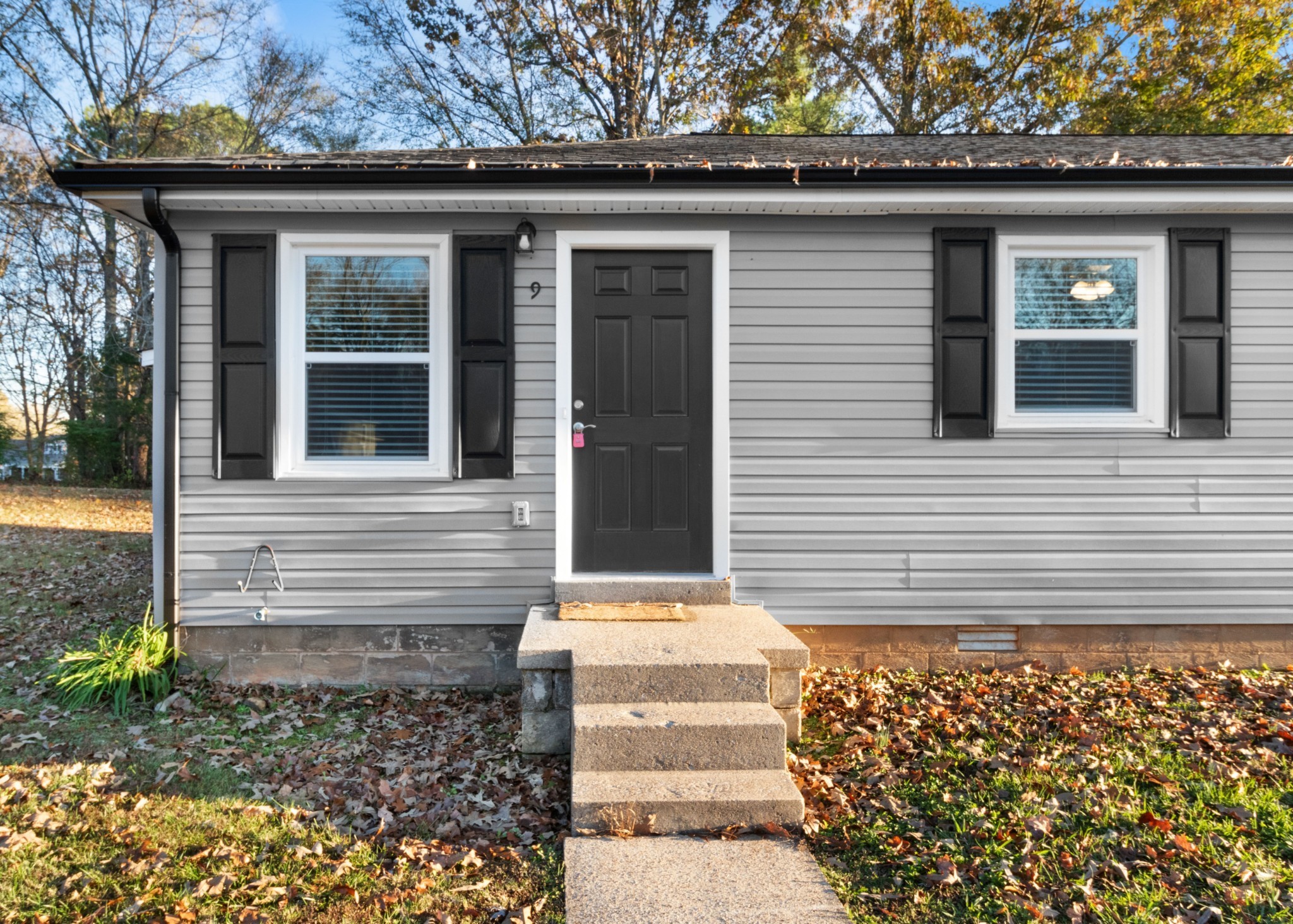 2251 7 Mile Ferry Road, Unit 9 Clarksville, TN 37040 - Photo 2 of 26 a front view of a house with a garden