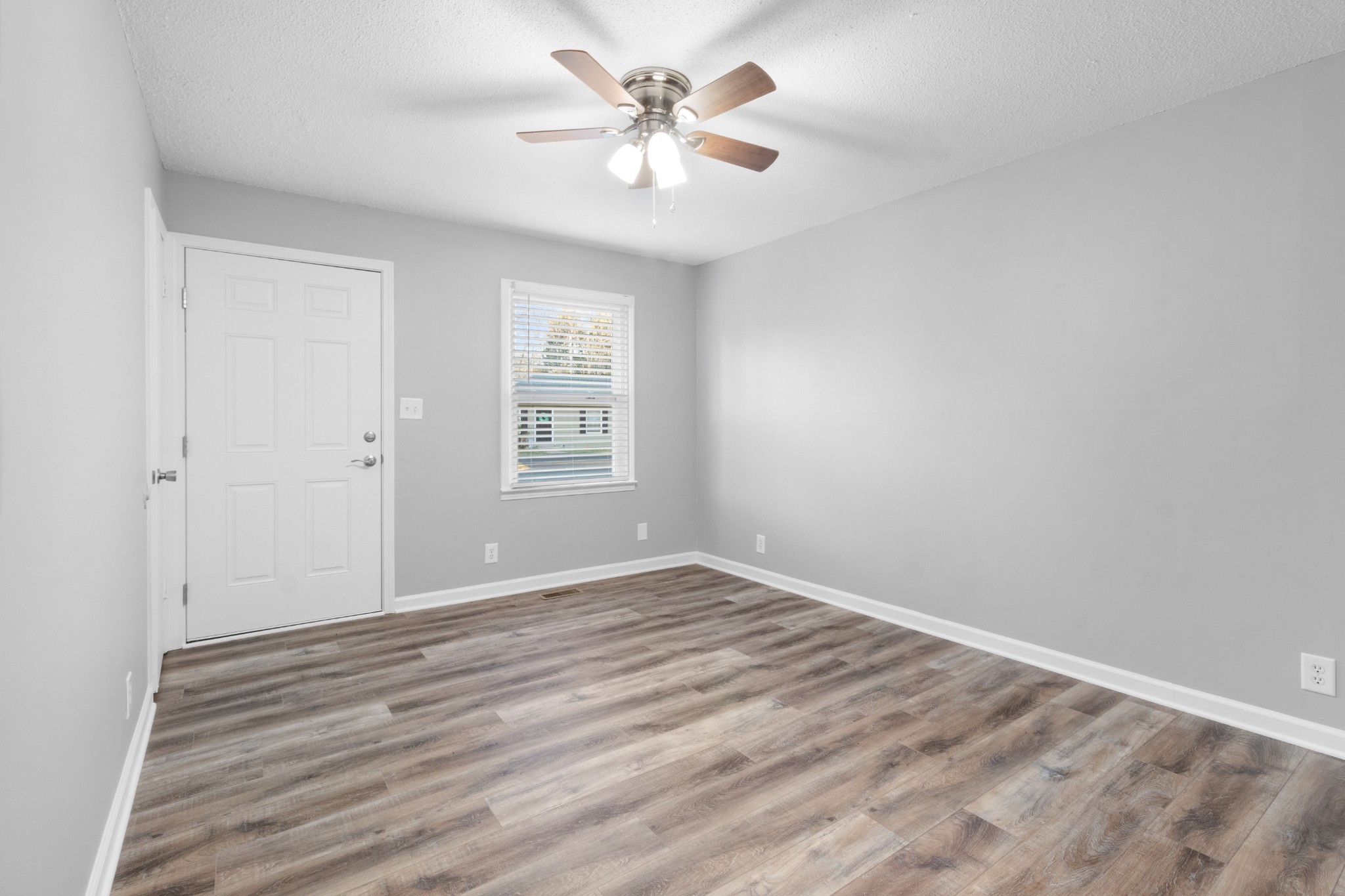 2251 7 Mile Ferry Road, Unit 9 Clarksville, TN 37040 - Photo 8 of 26 wooden floor in an empty room with a window