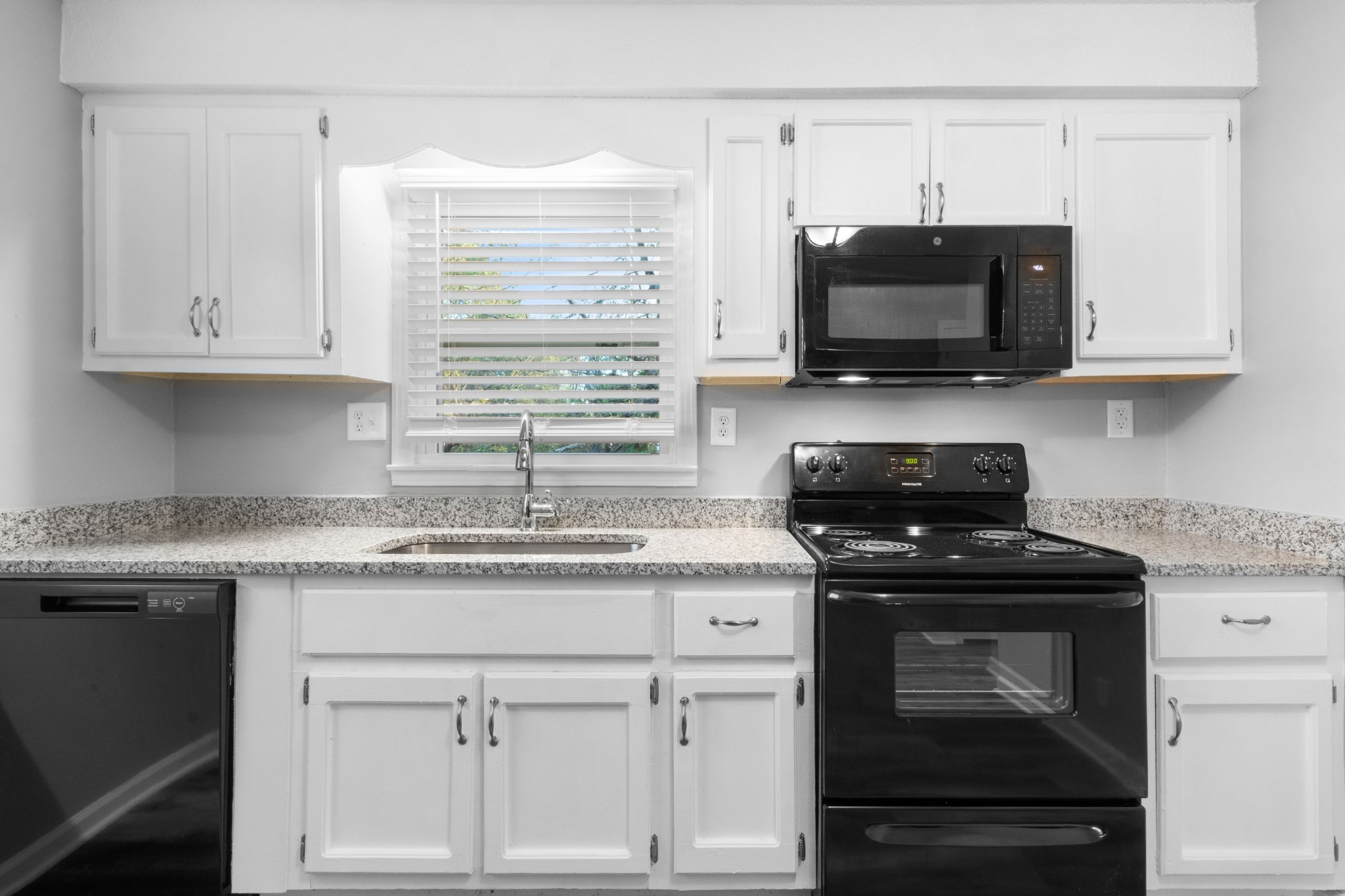 2251 7 Mile Ferry Road, Unit 9 Clarksville, TN 37040 - Photo 10 of 26 a kitchen with white cabinets and black appliances