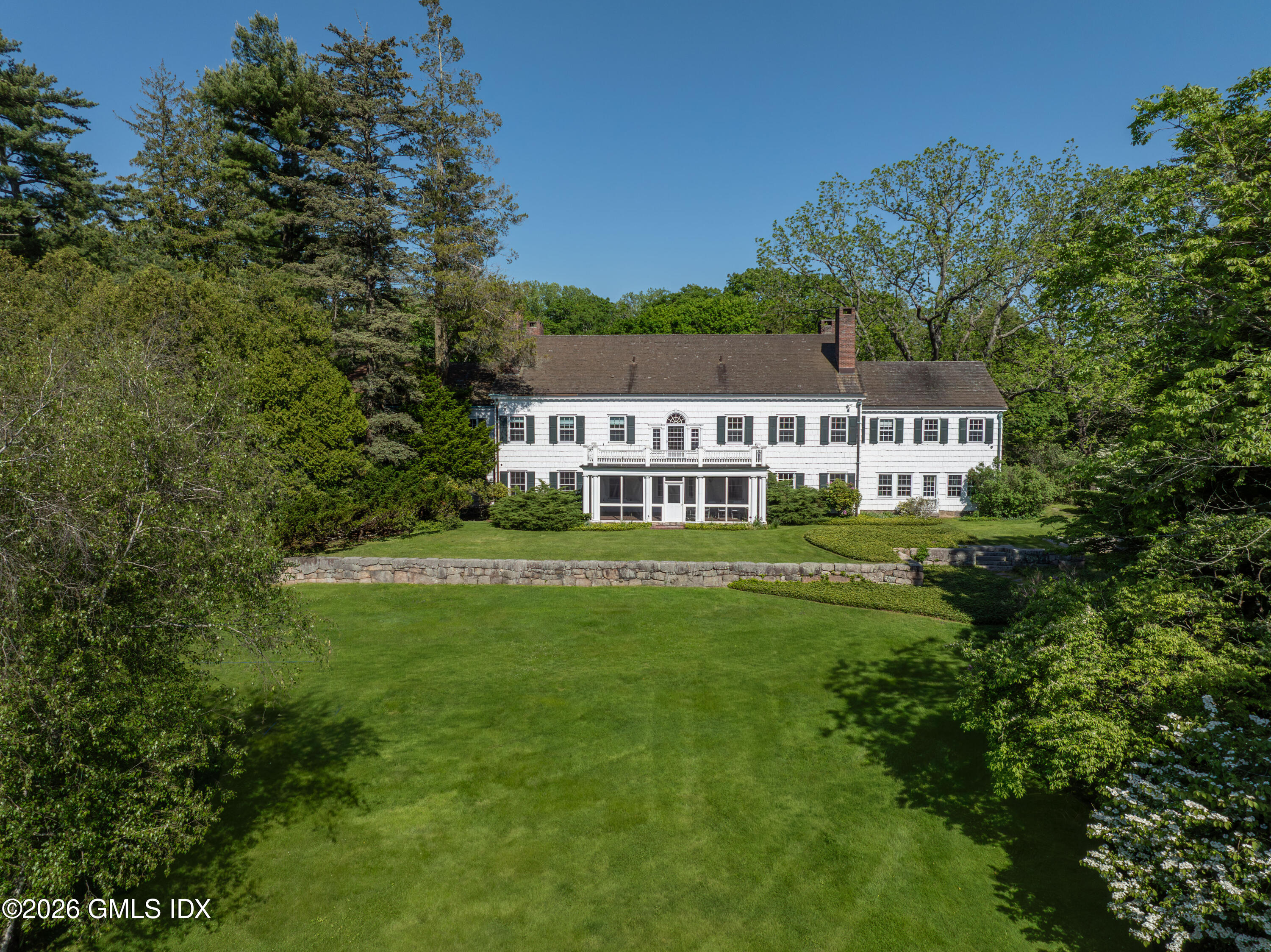 122 Round Hill Road Greenwich, CT 06831 - Photo 14 of 37 a view of house with a yard
