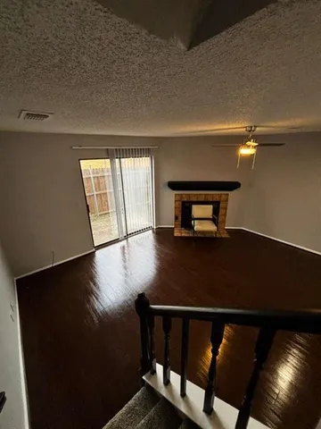 a view of a livingroom with furniture and window