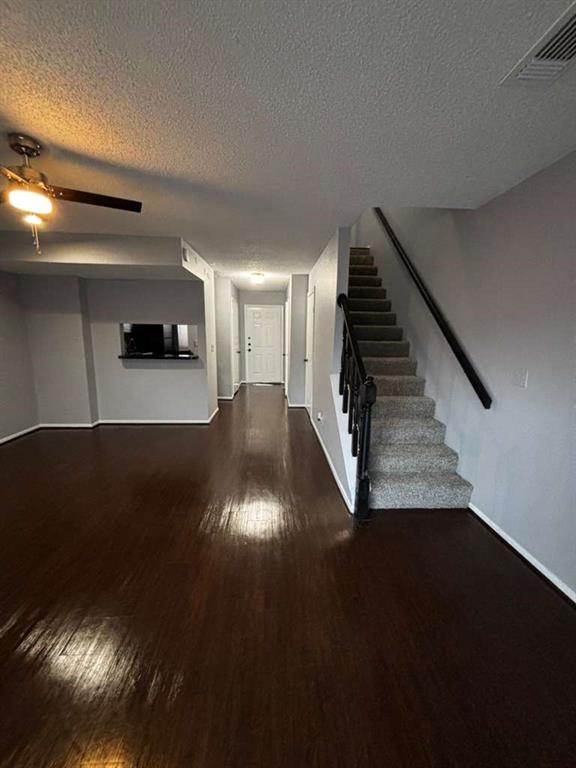 724 West Collins Street Denton, TX 76201 - Photo 9 of 12 a view of entryway and hall with wooden floor