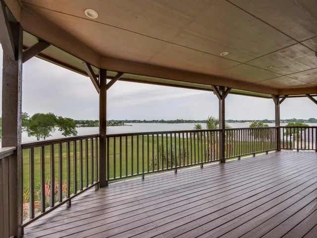 a view of a balcony with wooden floor
