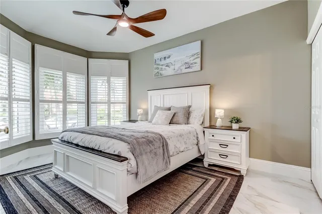 a spacious bedroom with a bed and window