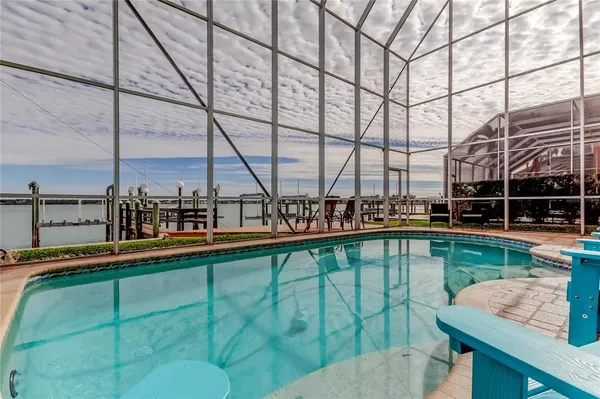 a view of swimming pool with outdoor seating