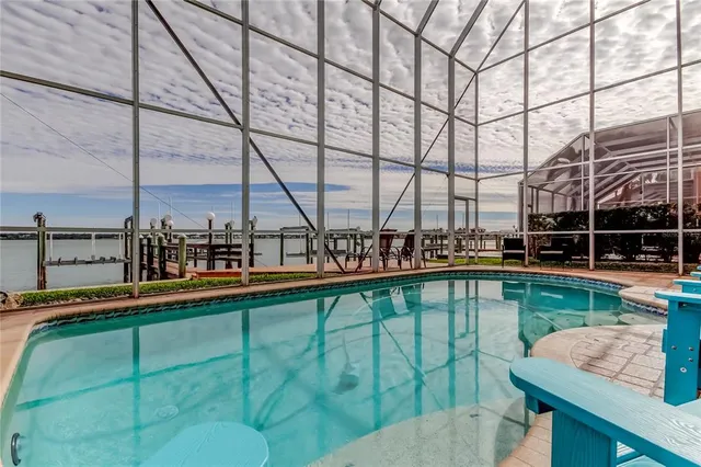 a view of swimming pool with outdoor seating