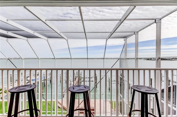 a view of a balcony with furniture