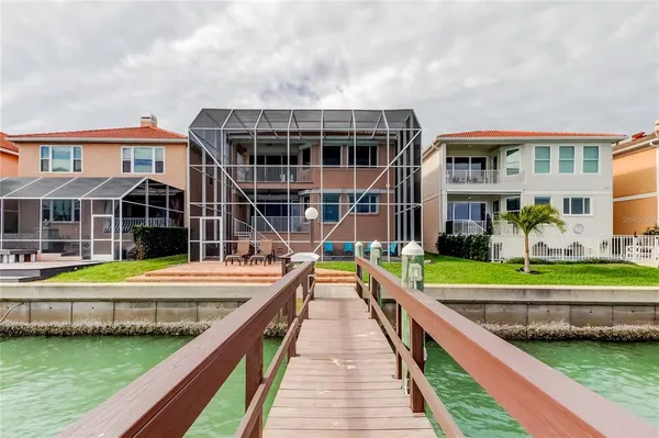 a view of swimming pool with a garden and plants