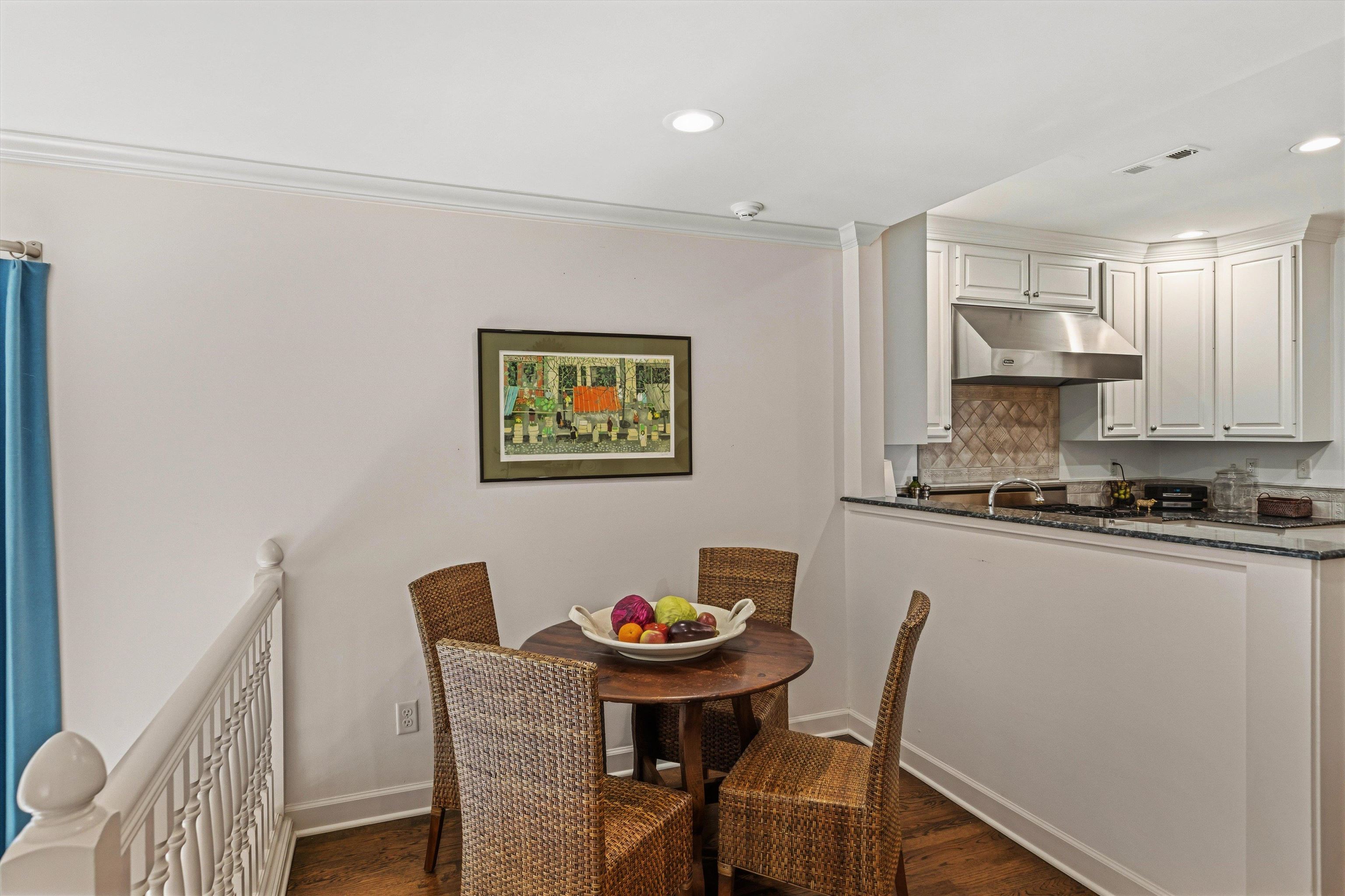 400 Colonial Road Memphis, TN 38117 - Photo 19 of 40 a kitchen with stainless steel appliances granite countertop a dining table chairs and a refrigerator