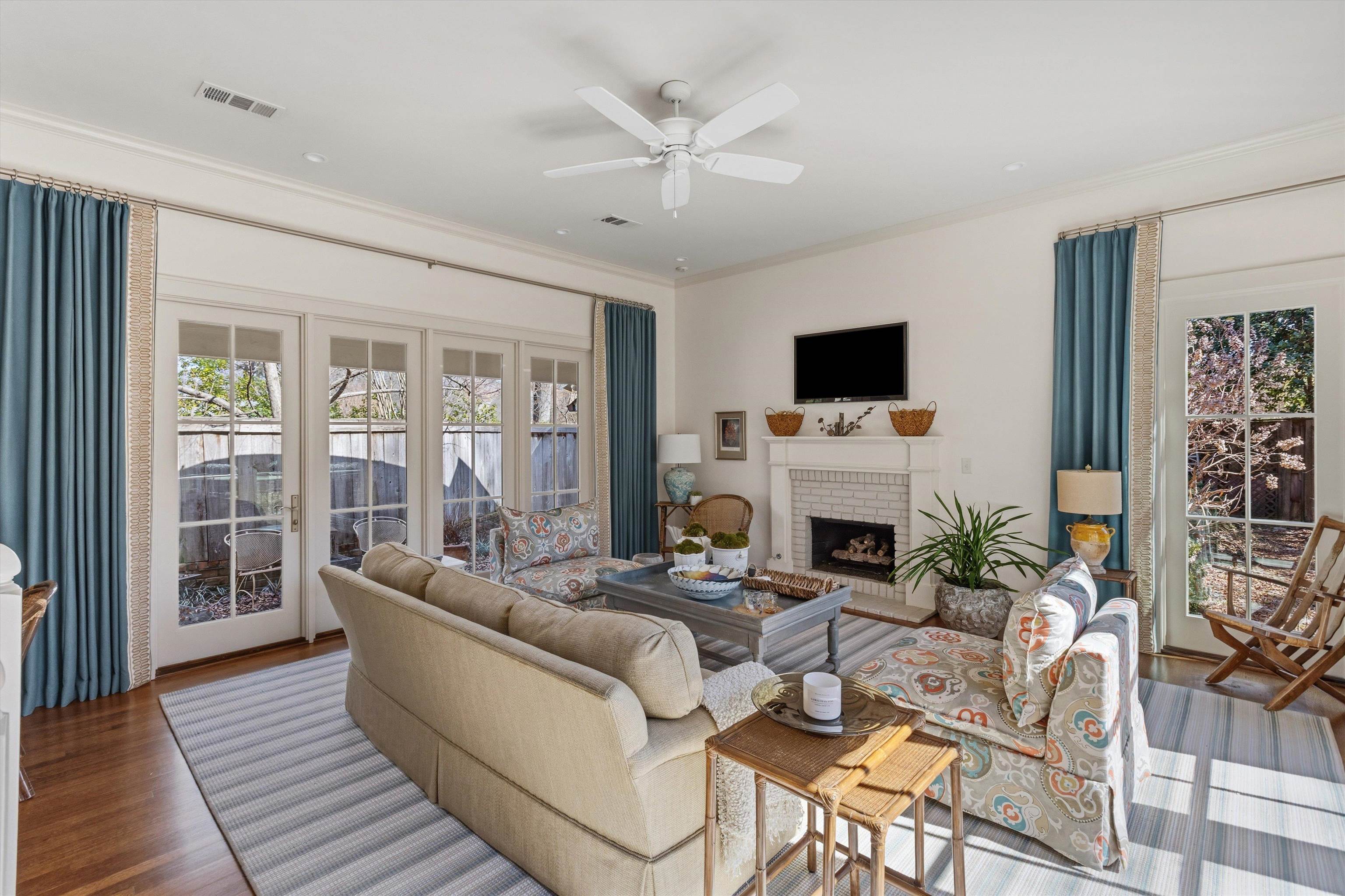 400 Colonial Road Memphis, TN 38117 - Photo 23 of 40 a living room with furniture a fireplace and a flat screen tv