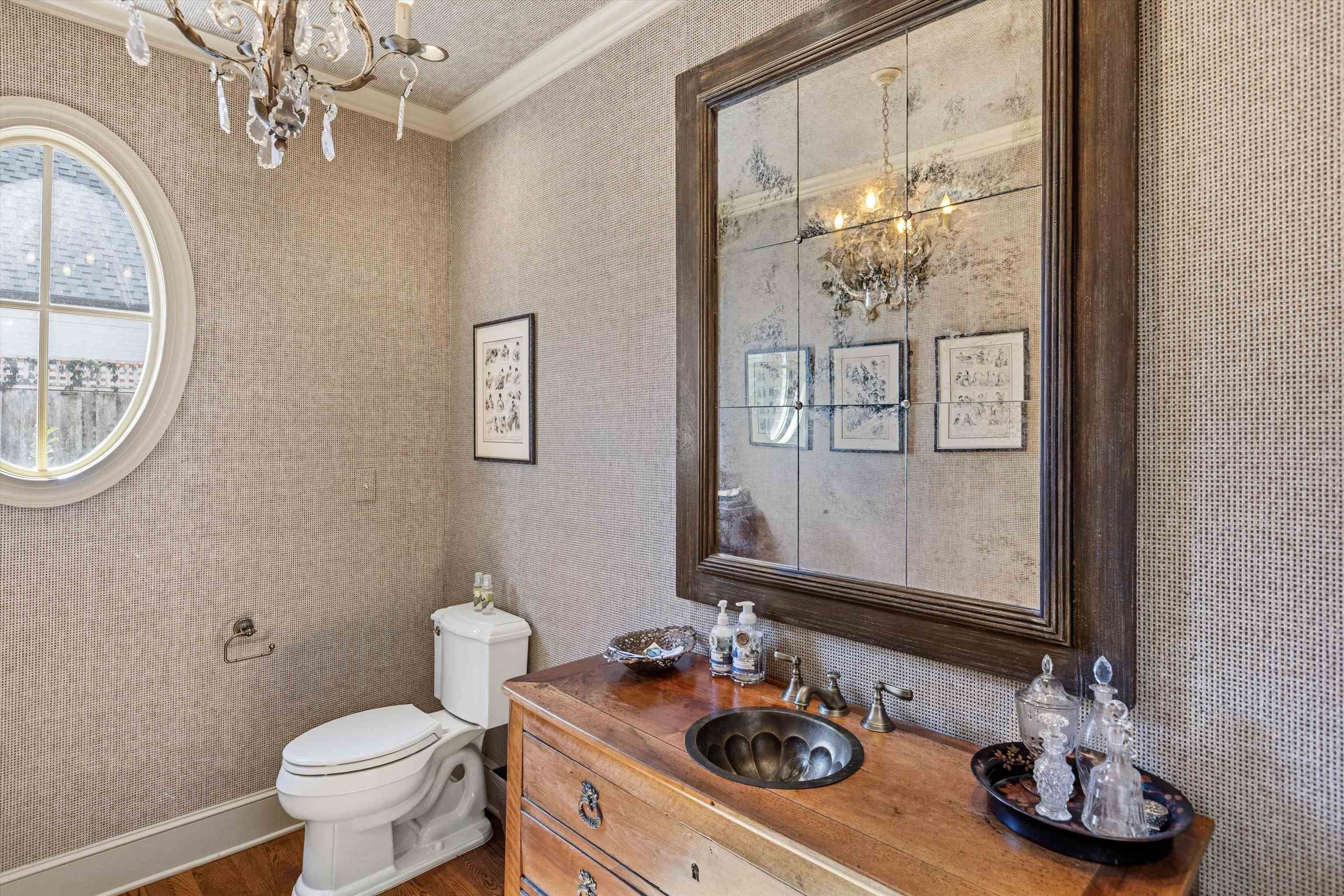 400 Colonial Road Memphis, TN 38117 - Photo 24 of 40 a bathroom with a sink a mirror and a toilet