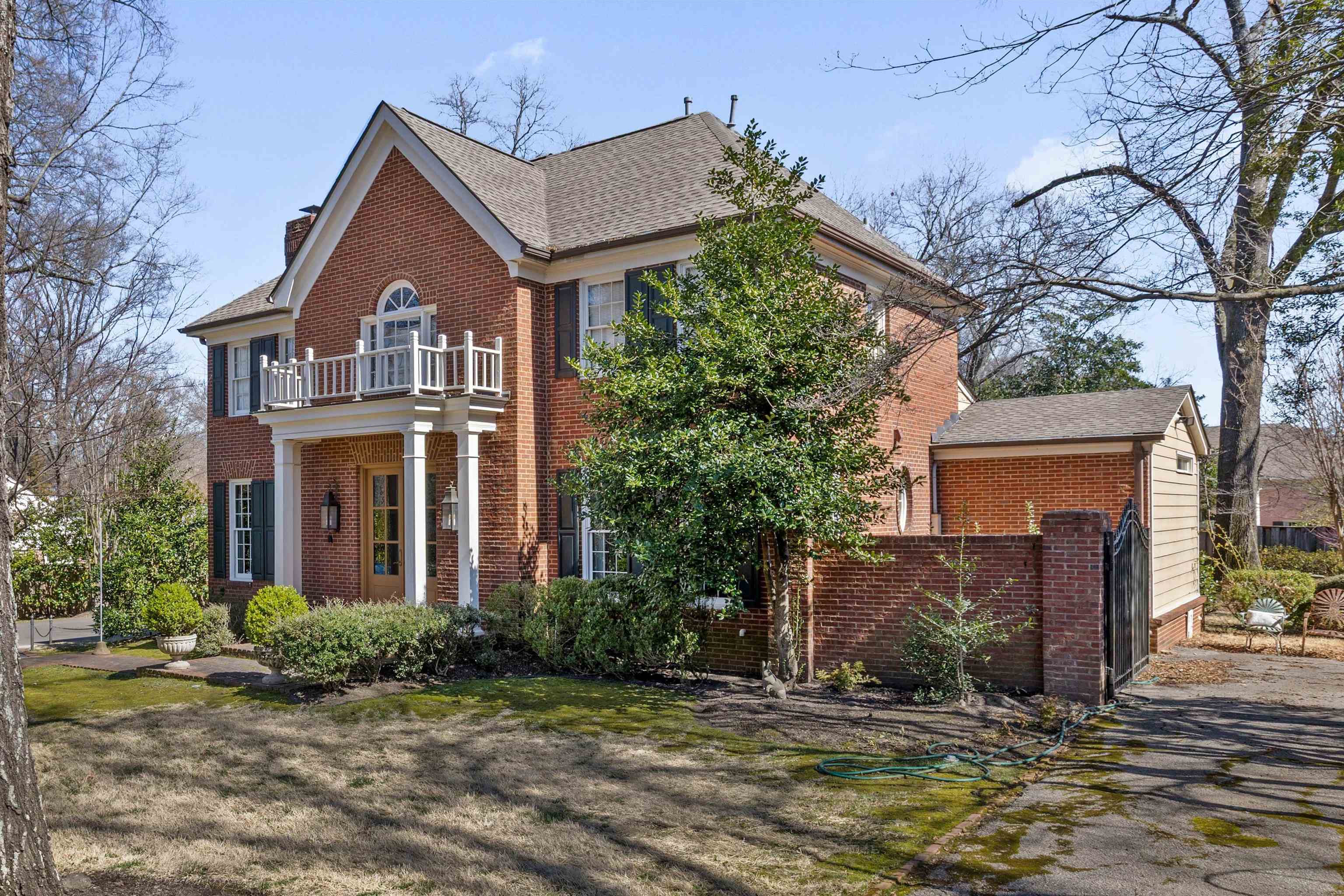 400 Colonial Road Memphis, TN 38117 - Photo 3 of 40 a front view of a house with a yard