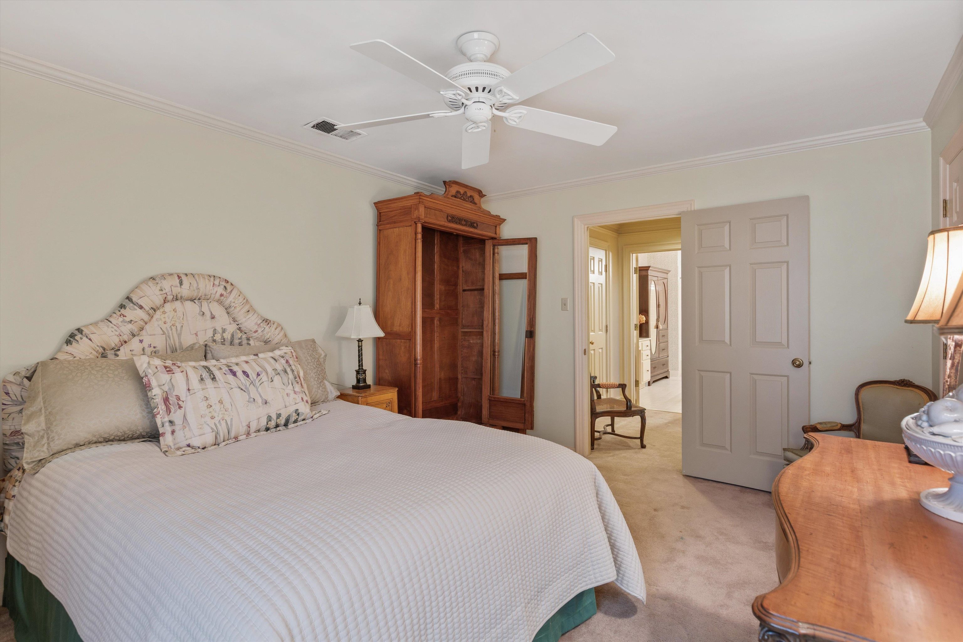 400 Colonial Road Memphis, TN 38117 - Photo 33 of 40 a bedroom with a bed and a chandelier