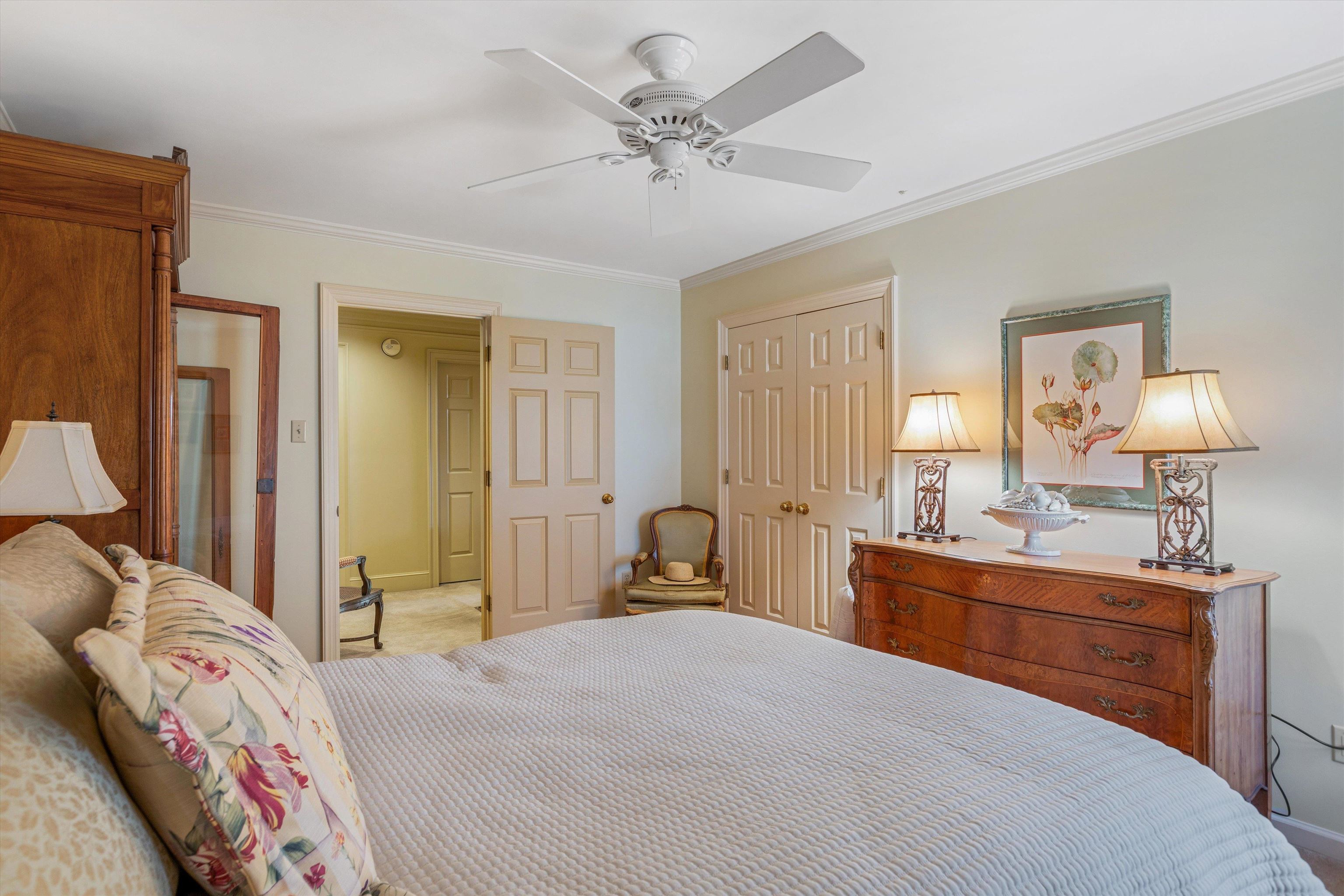 400 Colonial Road Memphis, TN 38117 - Photo 34 of 40 a bedroom with a bed and a chandelier