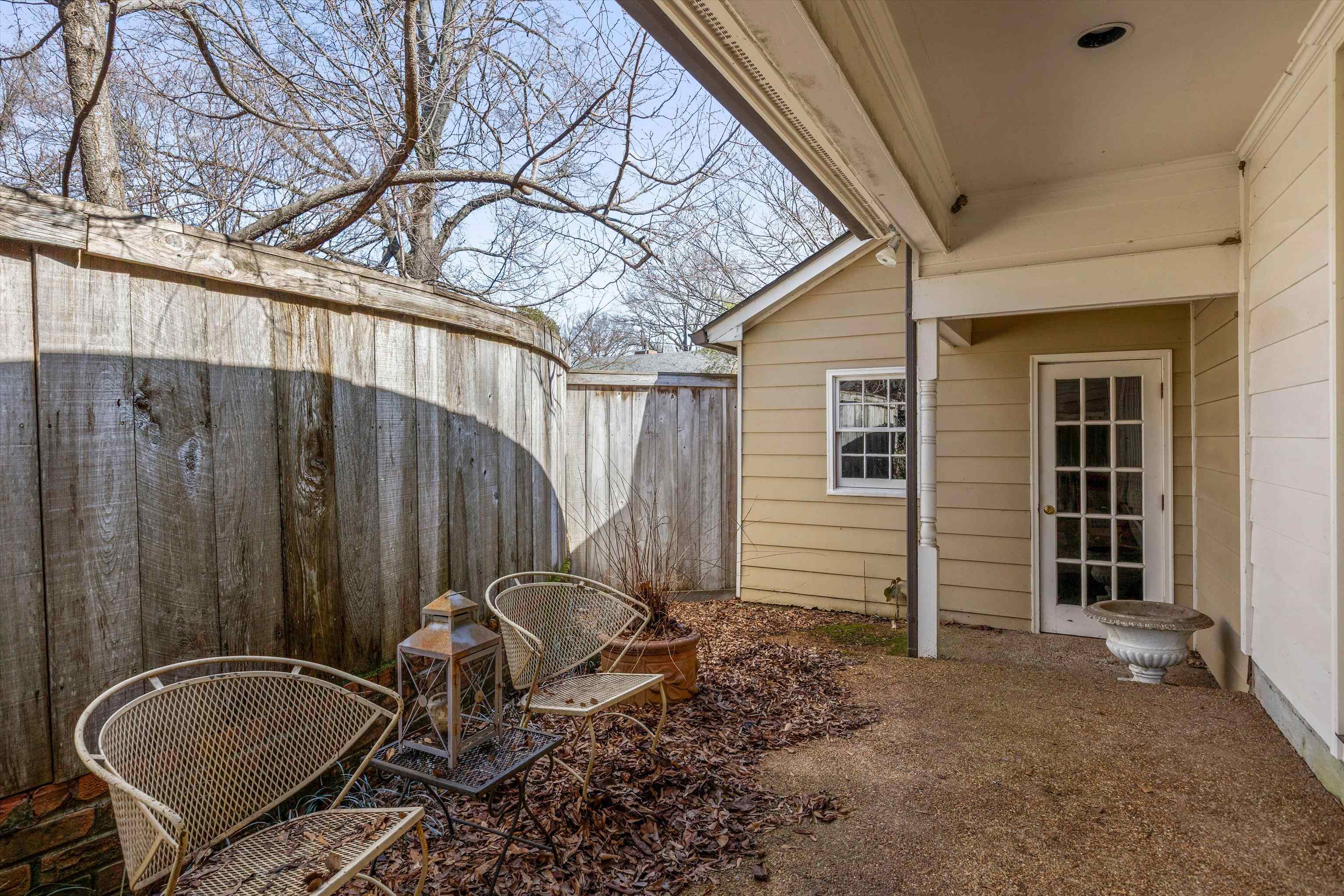 400 Colonial Road Memphis, TN 38117 - Photo 37 of 40 a backyard of a house with barbeque oven and glass windows