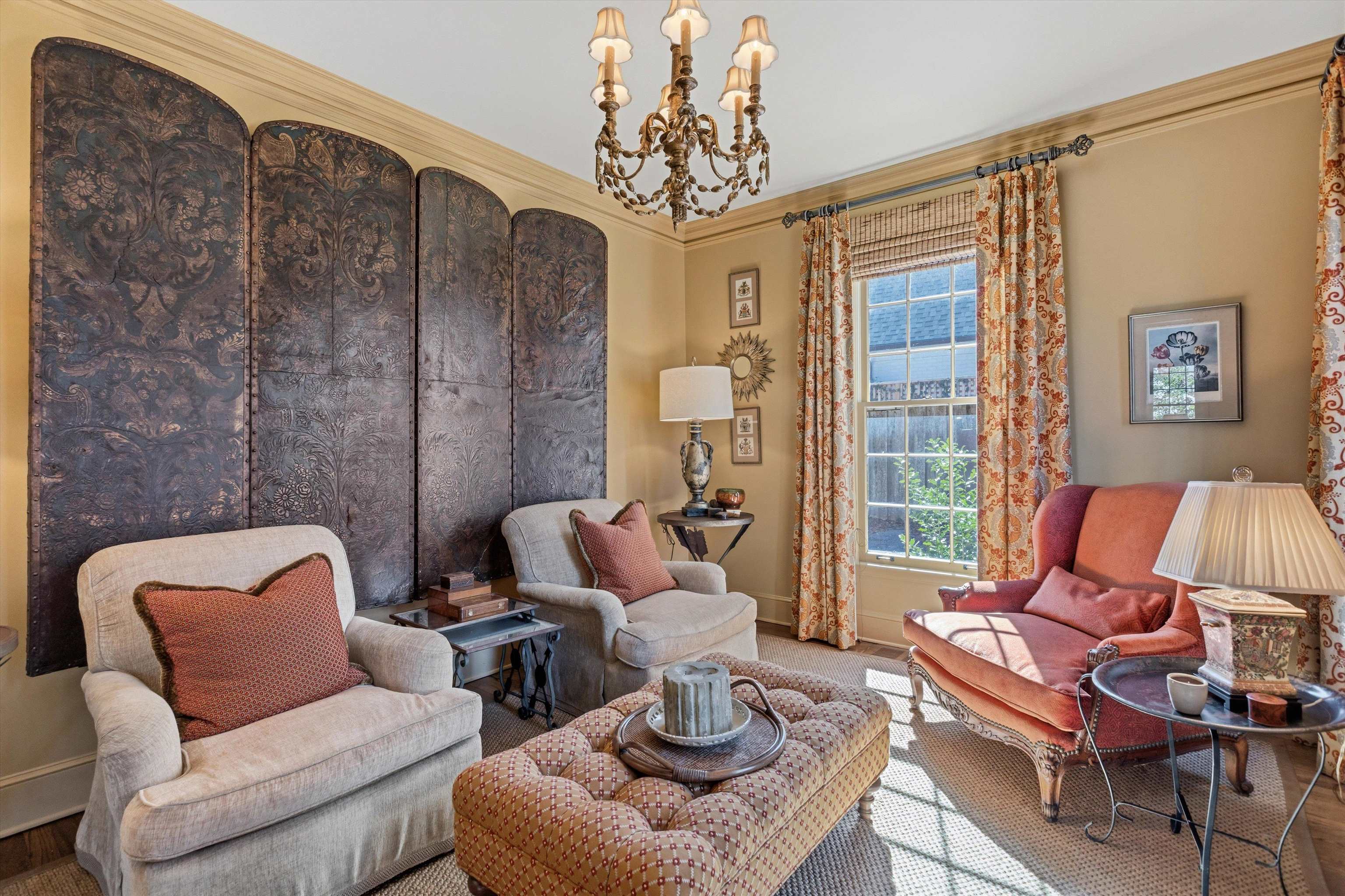 400 Colonial Road Memphis, TN 38117 - Photo 8 of 40 a living room with furniture a fireplace and a chandelier