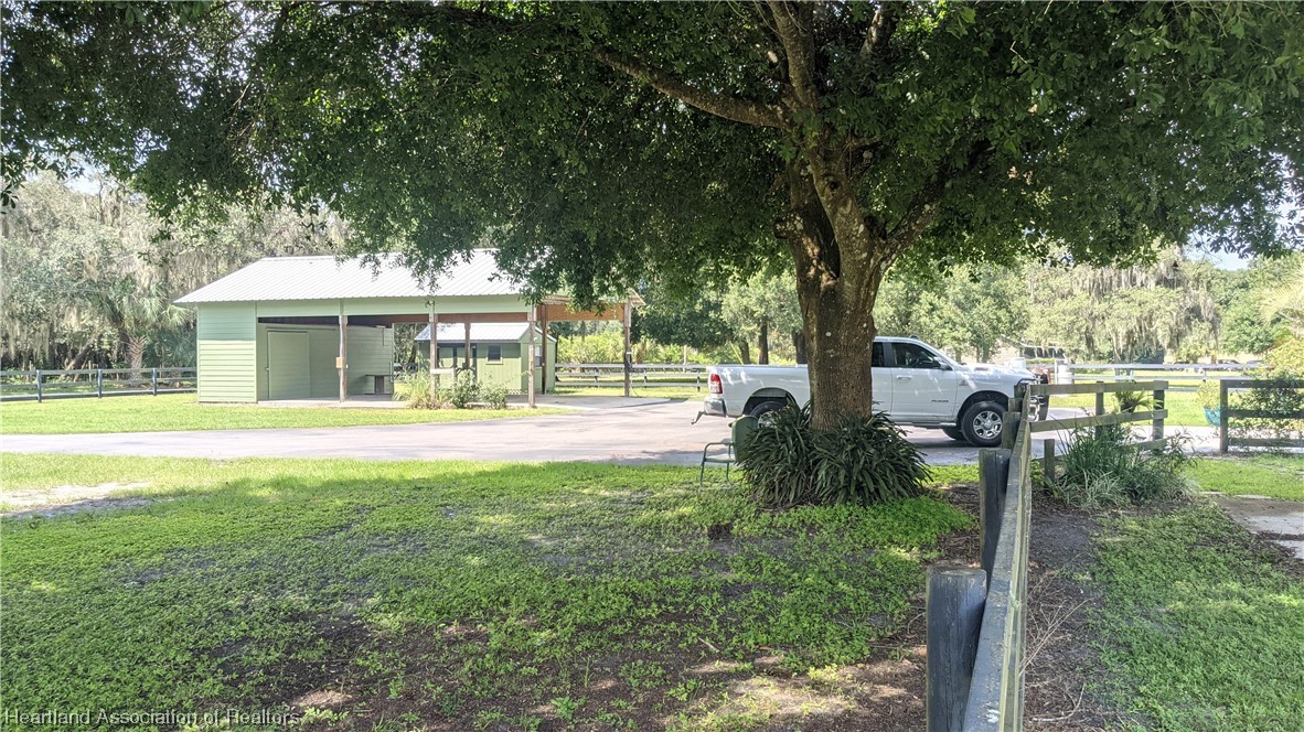 617 Bost Road Wauchula, FL 33873 - Photo 31 of 38 a front view of a house with a yard