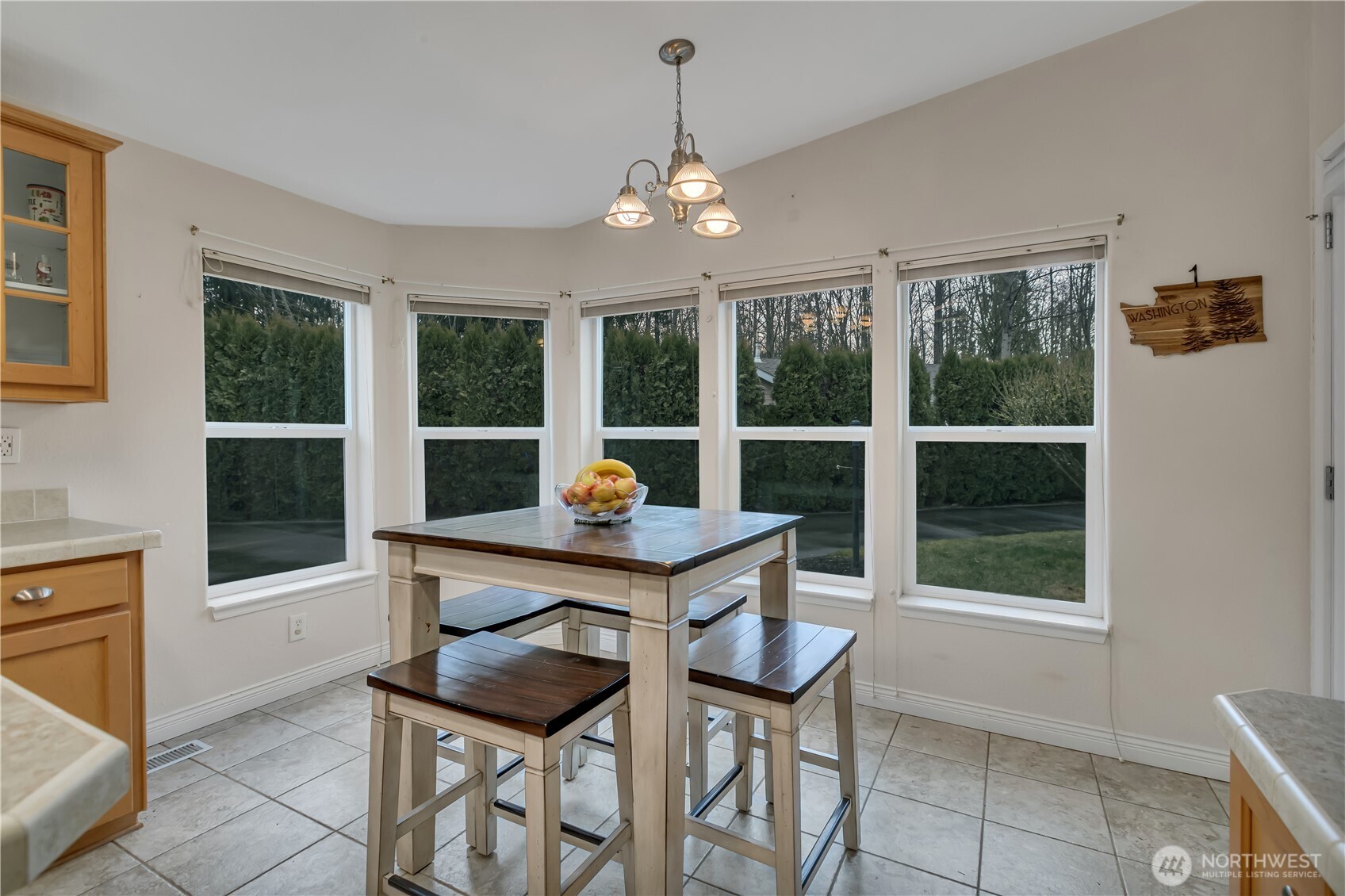 24319 68th Street East, Unit 84 Buckley, WA 98321 - Photo 14 of 40 a view of a dining room with furniture window and outside view