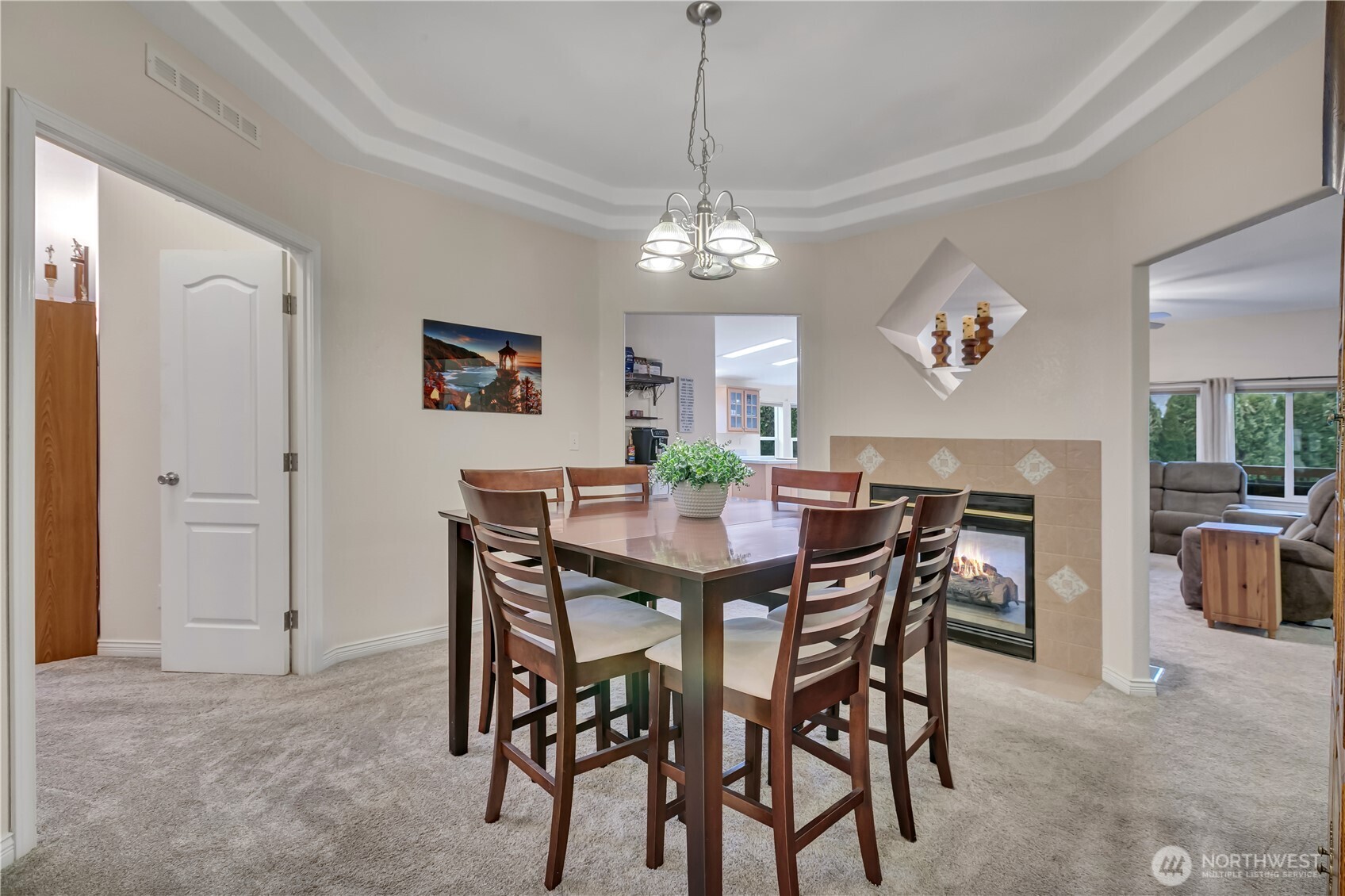 24319 68th Street East, Unit 84 Buckley, WA 98321 - Photo 17 of 40 a view of a dining room with furniture and chandelier