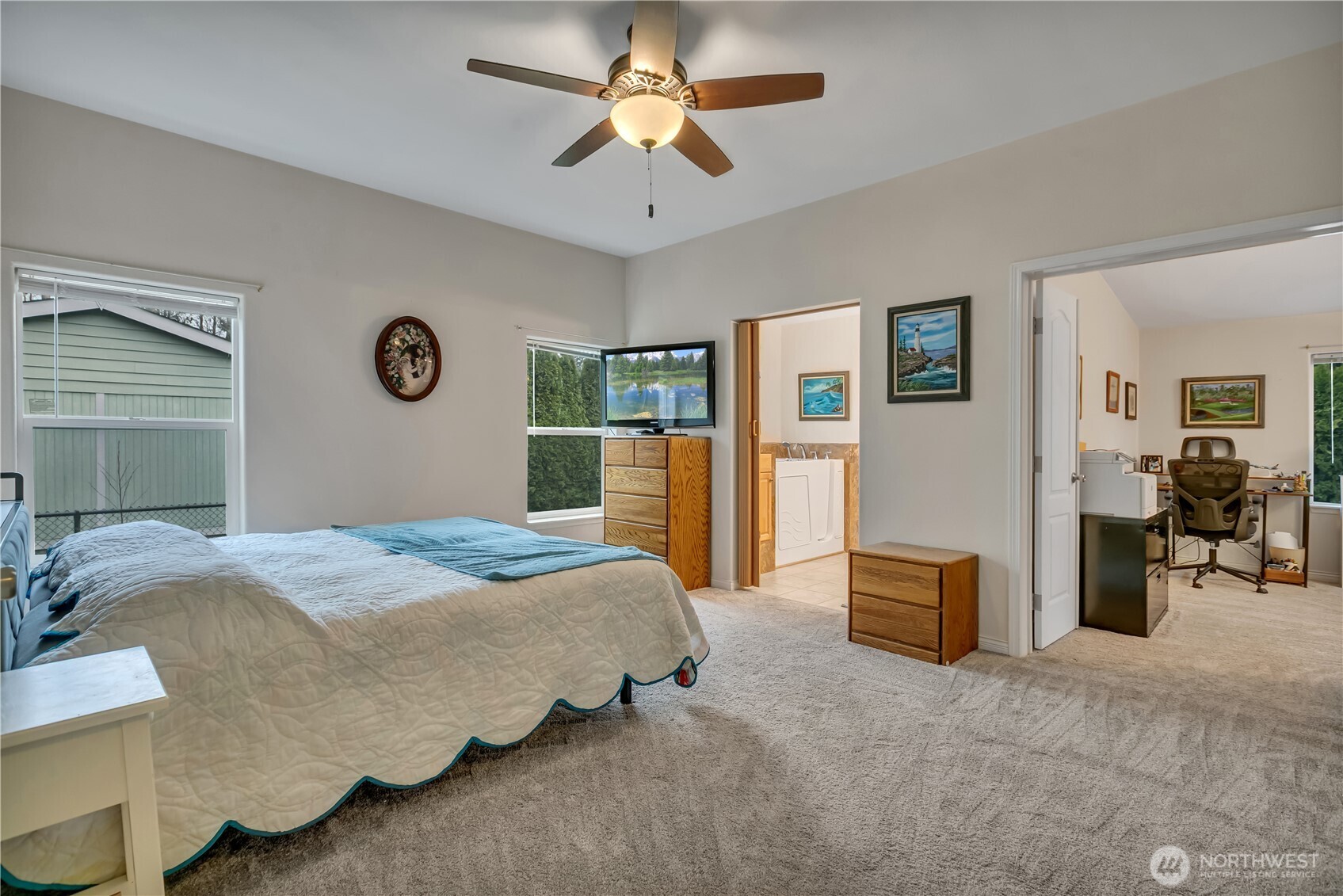 24319 68th Street East, Unit 84 Buckley, WA 98321 - Photo 18 of 40 a bedroom with a bed and ceiling fan